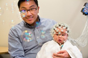 baby with medical device on head