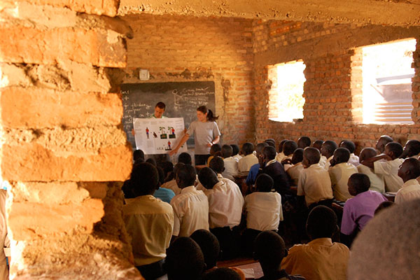 woman teaching in brick building