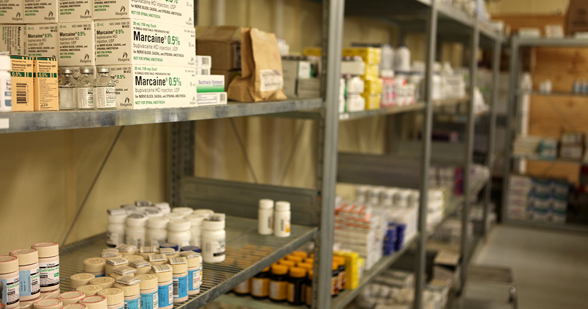 Medical supplies stacked on shelves in a warehouse.