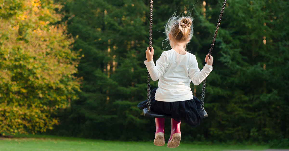 A young girl on a swing