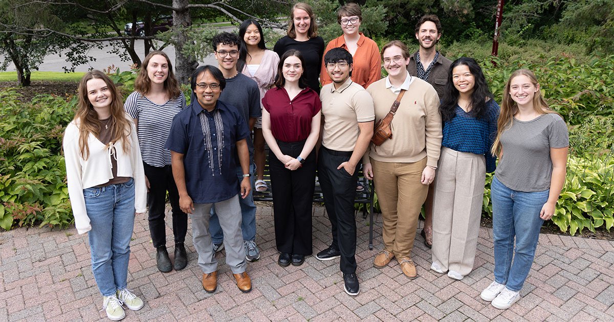 several students from the equitable data science summer program standing outside with Mark Fiecas