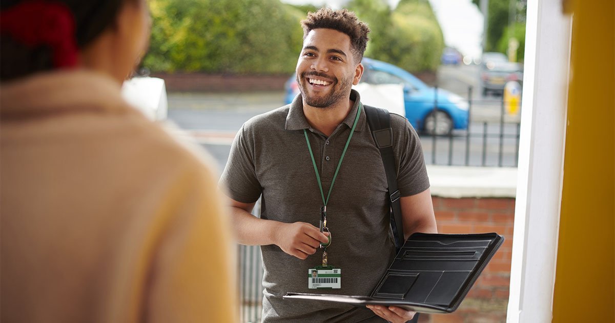person smiling at the front door